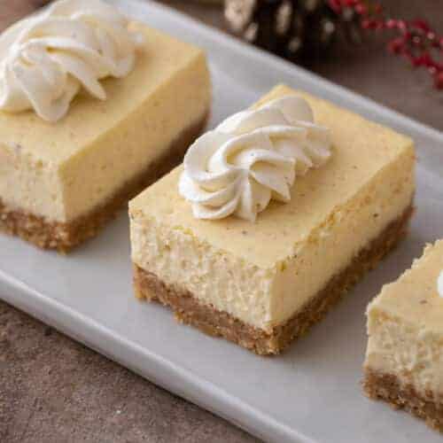 eggnog cheesecake bars on a plate