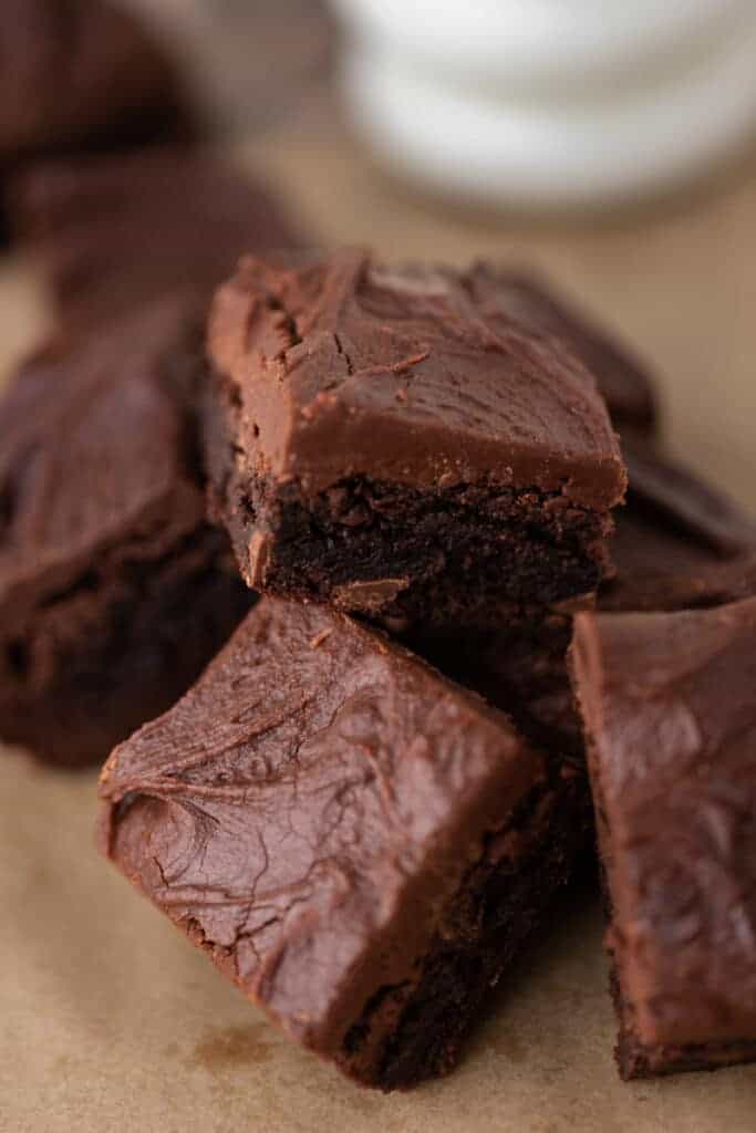 Brownies with frosting layered in a pile