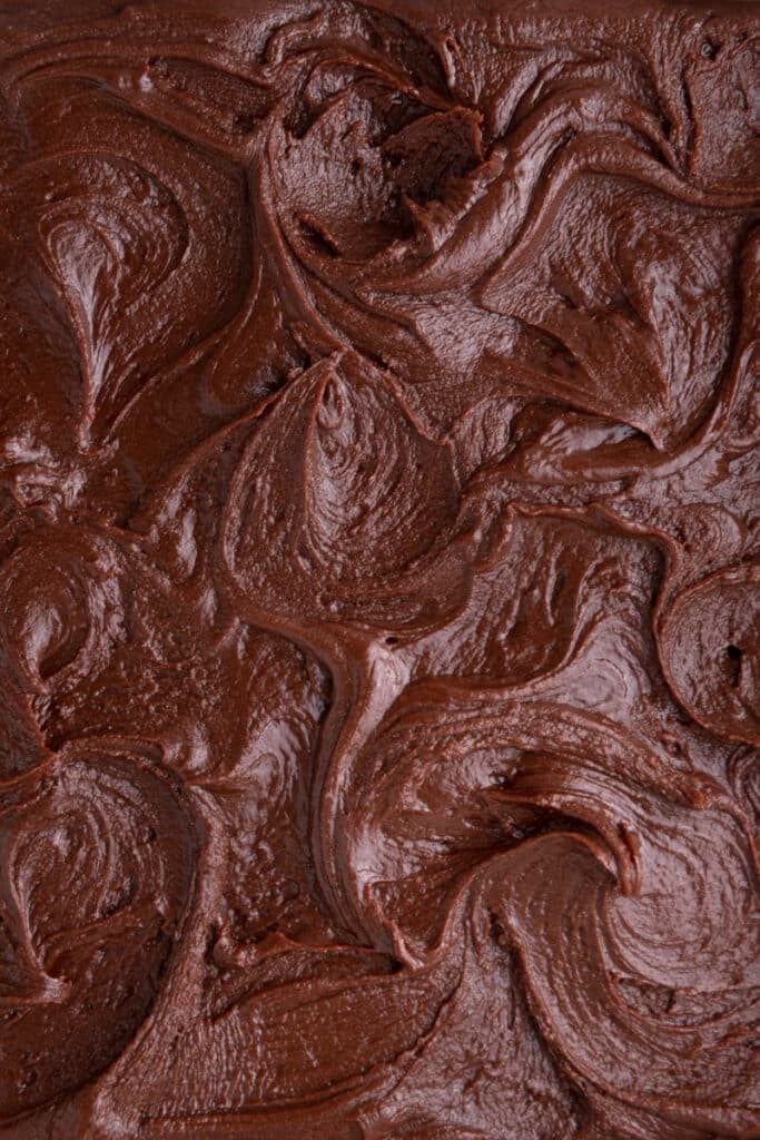 a solidified coating of brownie frosting