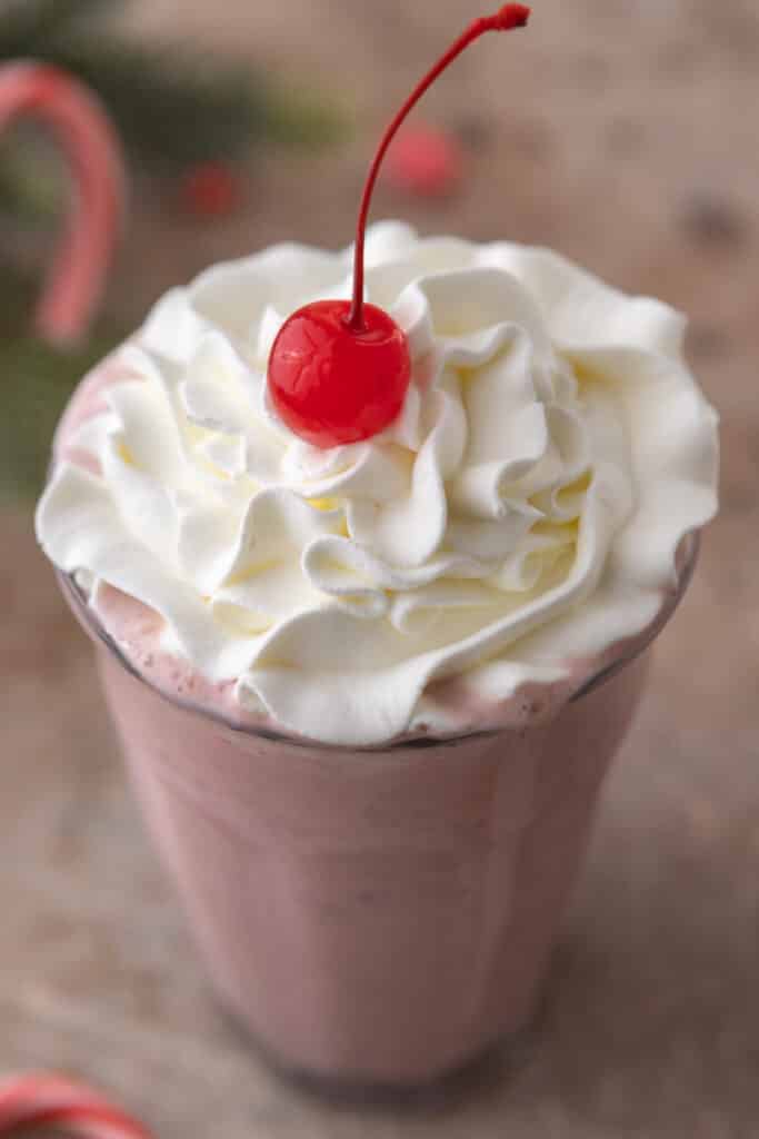 Close up of peppermint milkshake with whipped cream on top
