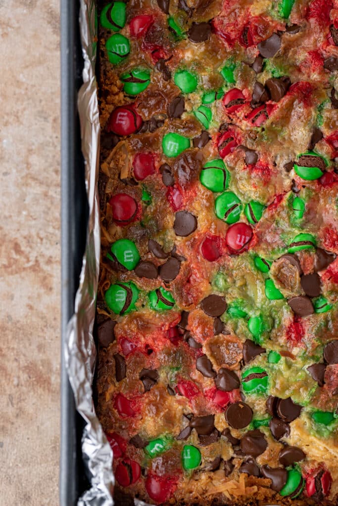 fully baked christmas magic cookie bars in a pan