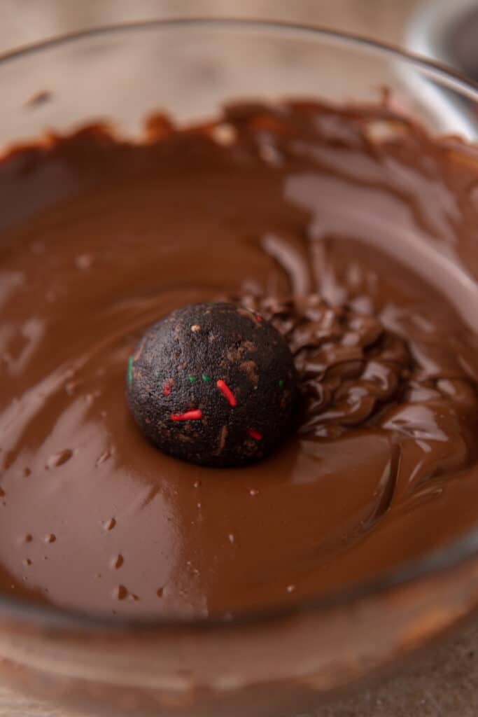 a ball being dipped in chocolate