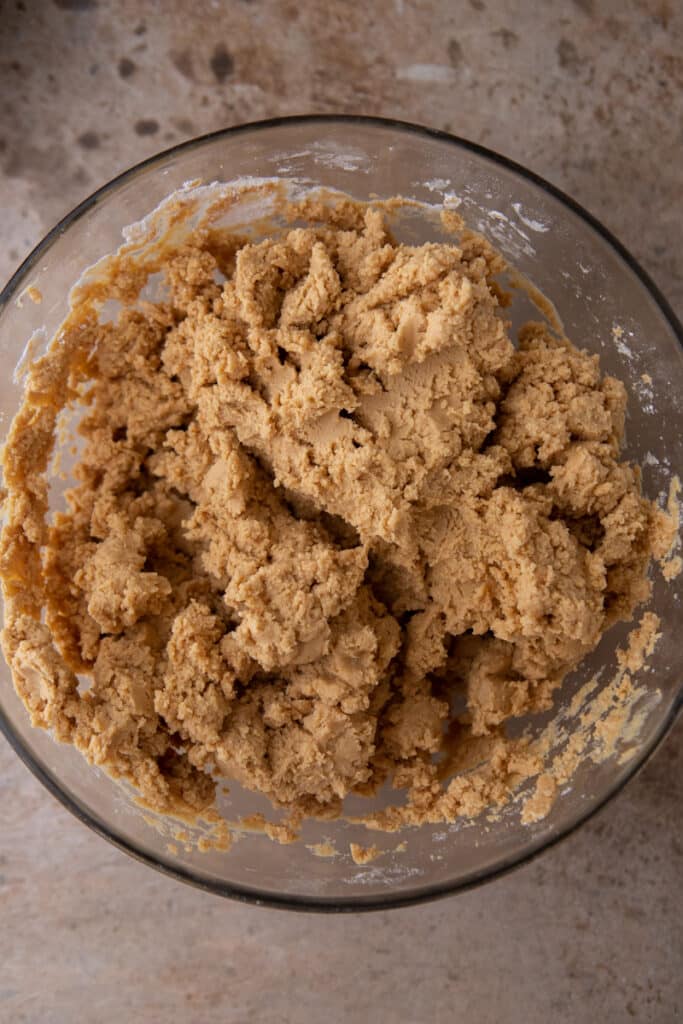 mixed ingredients for the peanut butter layer in a bowl