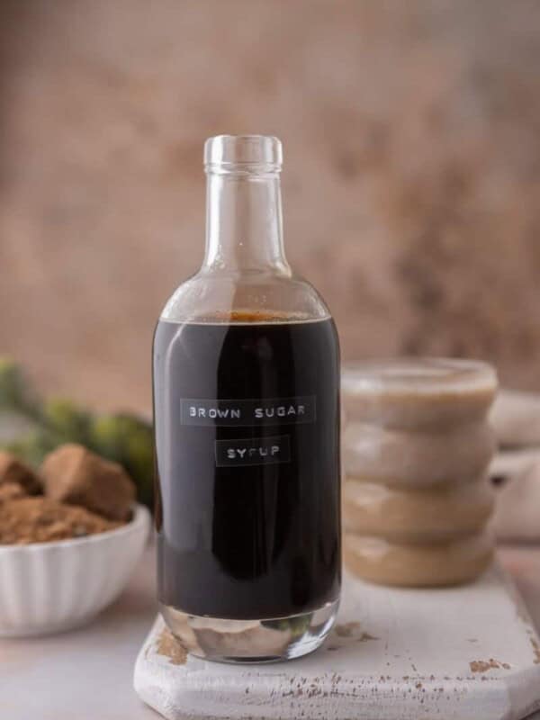 starbucks brown sugar syrup recipe sitting in front of a cup of coffee