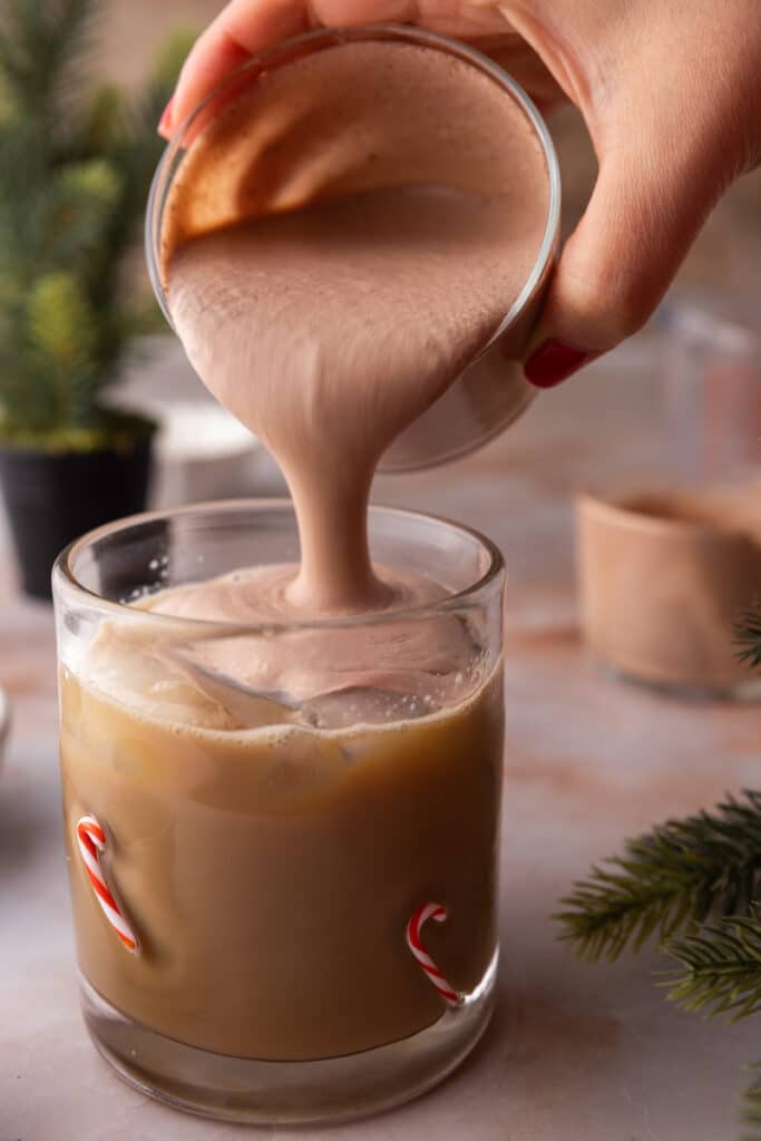 Chocolate cold foam poured over coffee