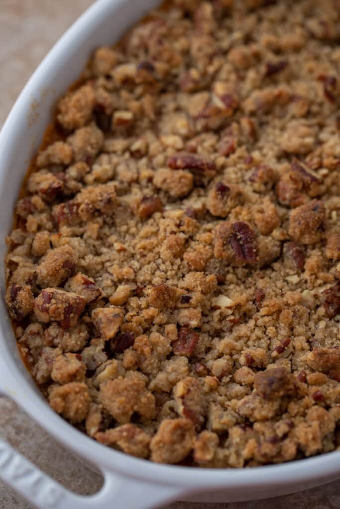 close up shot of the sweet potato casserole with pecan topping