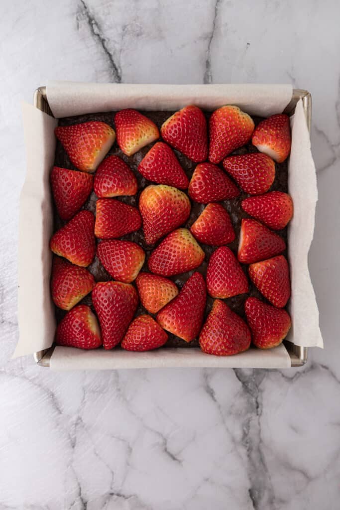Strawberries on top of fudge brownie