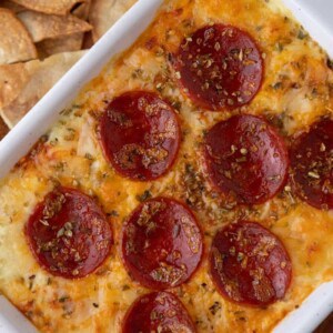 overhead shot of a diagonal plate of fully cooked cottage cheese pizza bowl dip