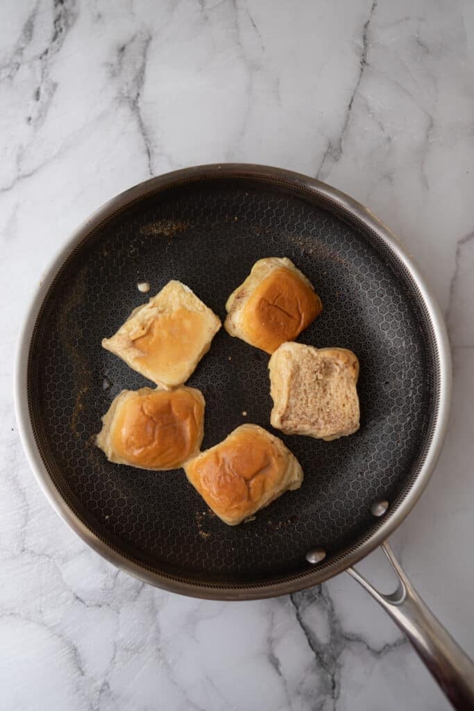 battered bread being cooked on a skillet