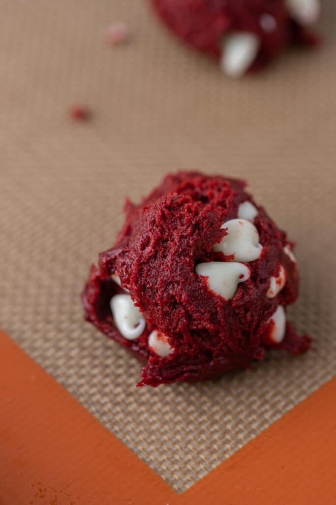 Red velvet Cookie dough on a baking sheet