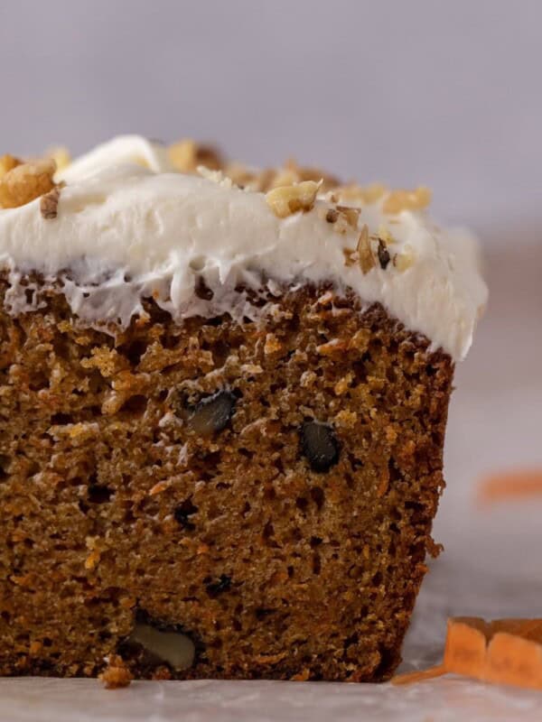 Close-up of moist carrot loaf crumb with cream cheese frosting