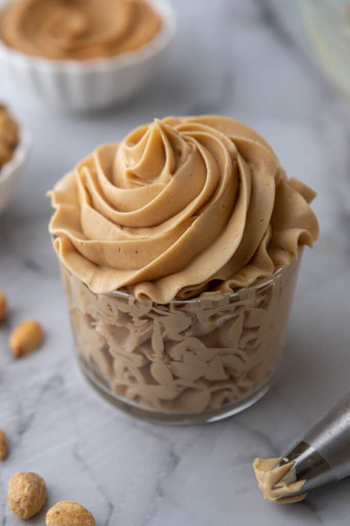 angled overhead shot of how to make peanut butter frosting in a cup