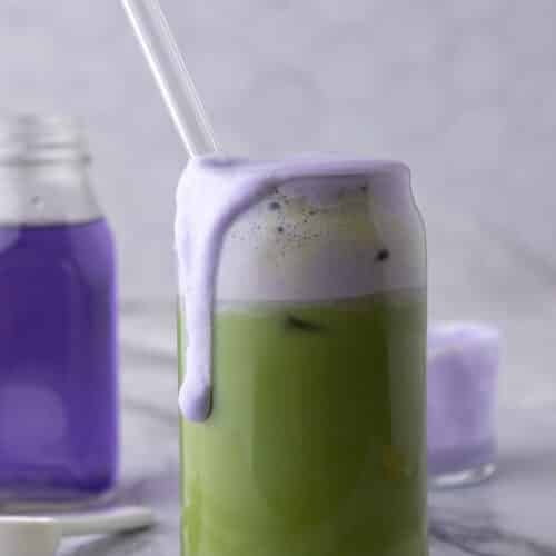 a finished iced starbucks oatmilk matcha lavender cream recipe in a glass