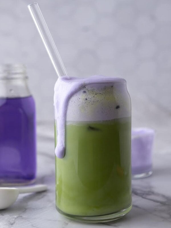 a finished iced starbucks oatmilk matcha lavender cream recipe in a glass