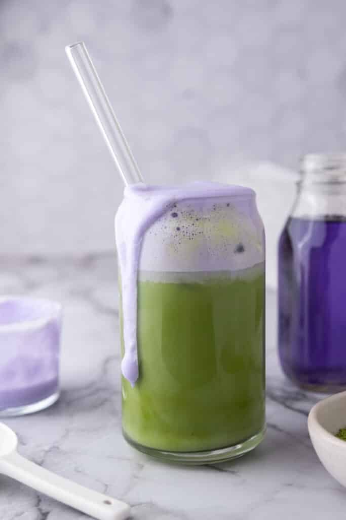 side shot of starbucks oatmilk matcha lavender cream recipe in a glass with a straw