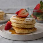 pancakes recipe for two on a plate with strawberries on it