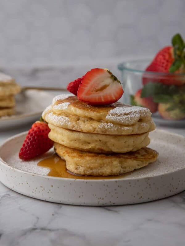 pancakes recipe for two on a plate with strawberries on it