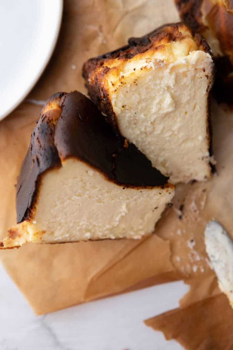 6-inch burnt basque cheesecake slices on parchment paper