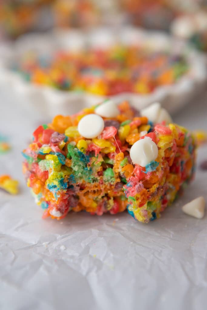 Close up of Fruity Pebbles rice krispies with a bite taken out of them