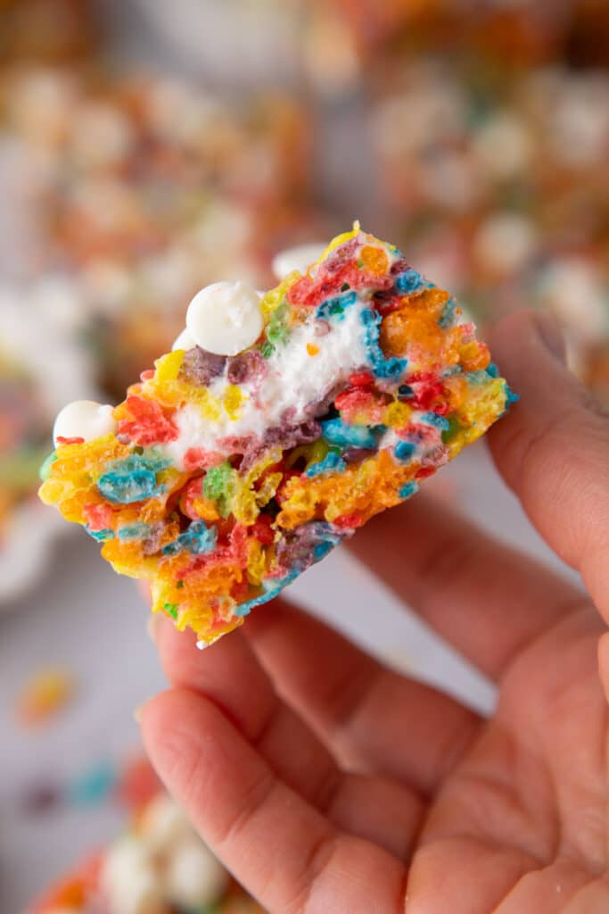 Hand holding Fruity Pebbles Rice Krispies 