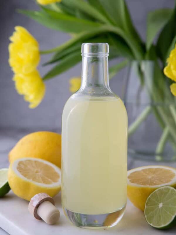 how to make homemade lemon sour mix in a bottle on a table