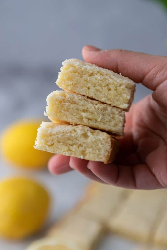 hand holding lemon sugar cookie bars