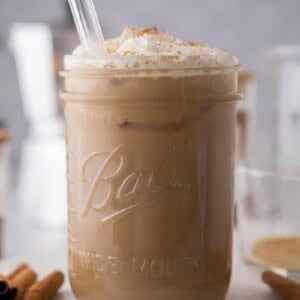a maple latte in a glass with a straw