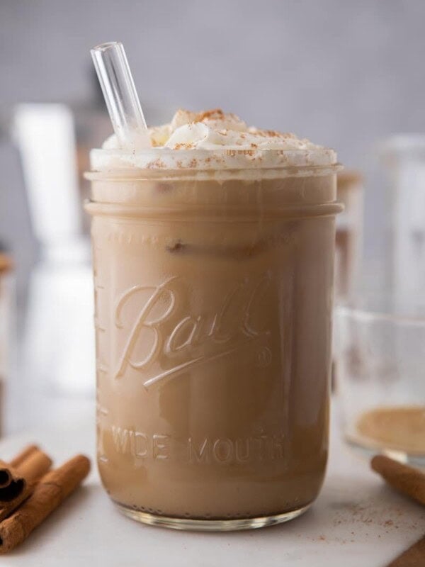 a maple latte in a glass with a straw