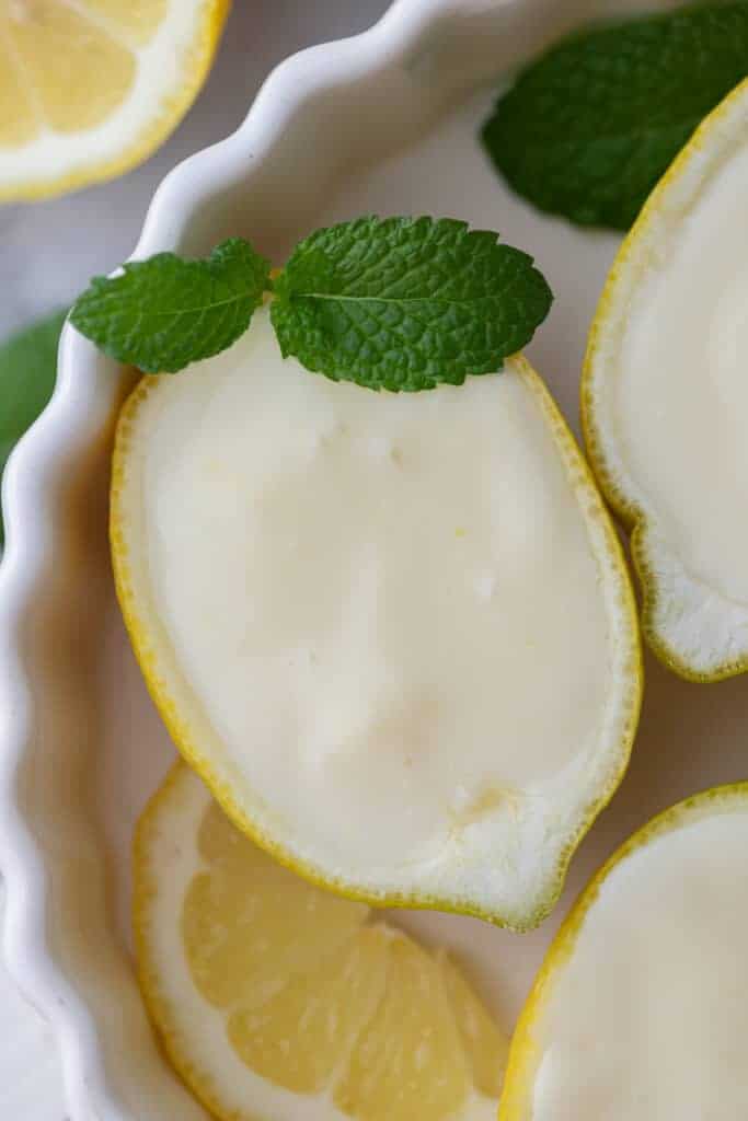 overhead shot of the easy lemon posset recipe with a mint