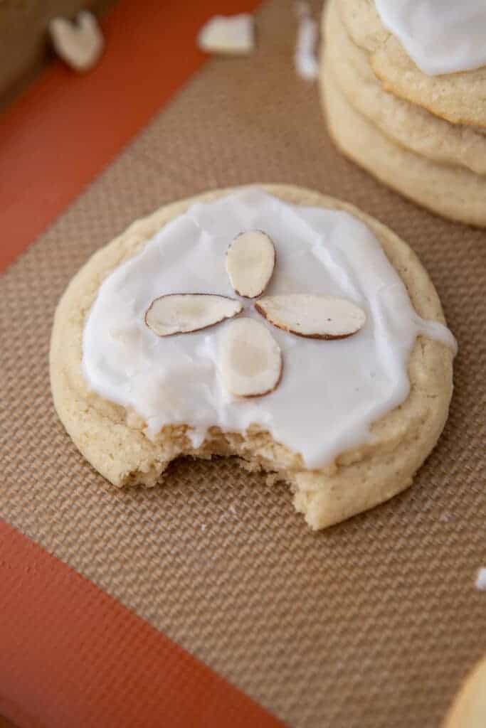 Almond sugar cookie with a bite taken out of it