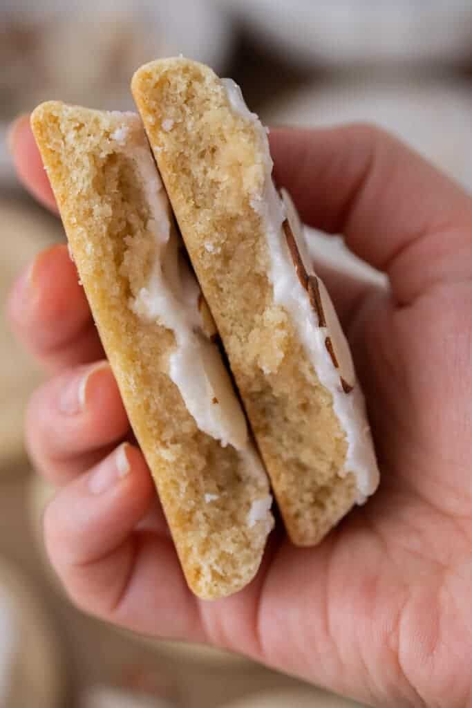 Hand holding soft almond cookies