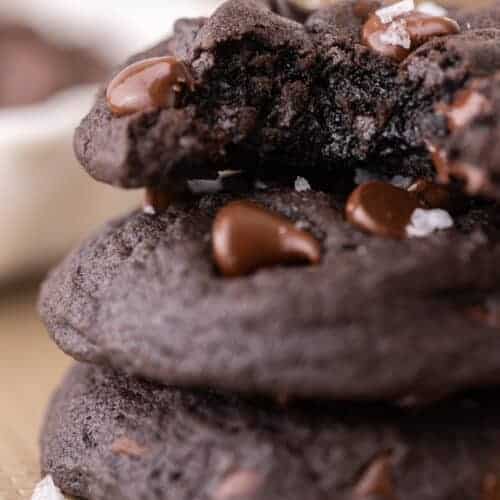 three Chocolate Chip Black Cocoa Cookies stacked on top of each other