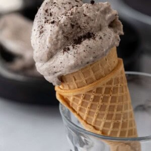 side shot of the ninja creami cookies and cream recipe on a cone