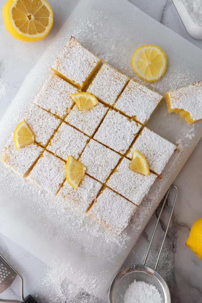 fully baked easy lemon bars recipe cut into squares