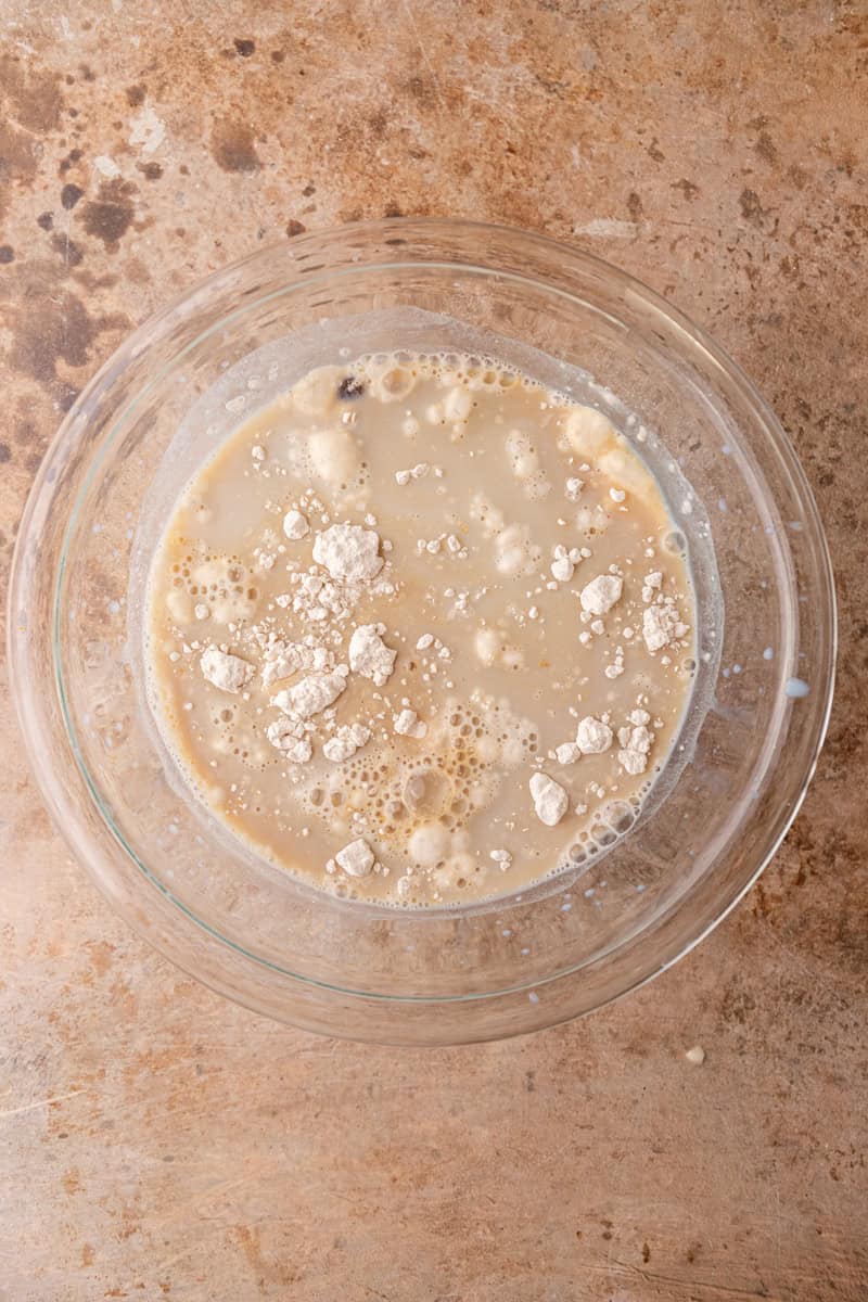 Flour, sugars, baking powder, and salt in a mixing bowl for the cobbler batter.