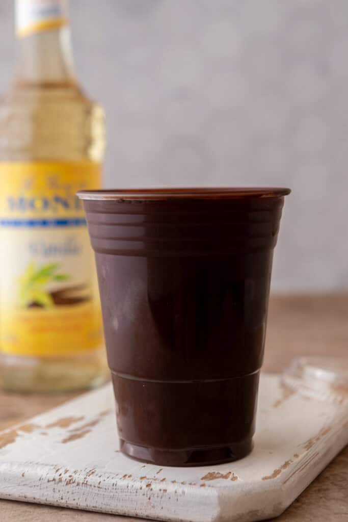 Plastic cup coated in melted chocolate