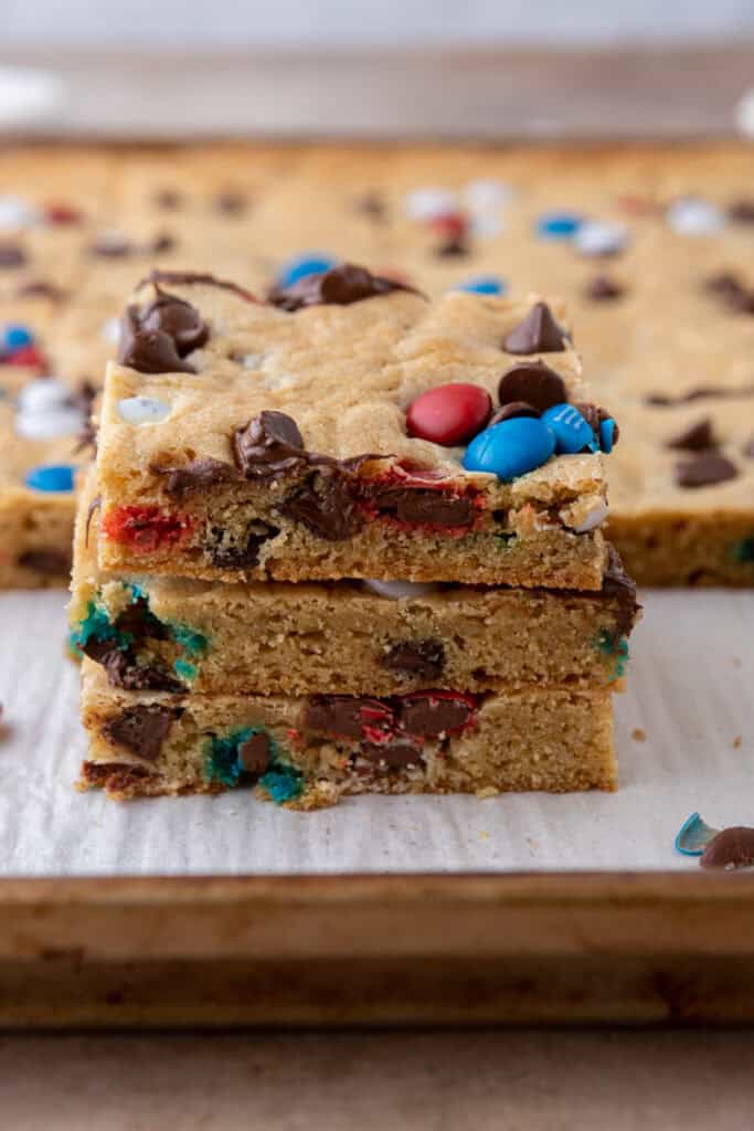 Straight on shot of red white and blue m&m's sheet pan cookies