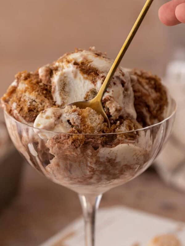 No churn tiramisu ice cream in a glass with a spoon