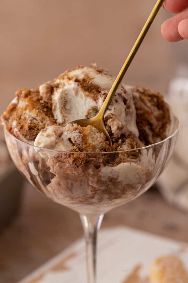 No churn tiramisu ice cream in a glass with a spoon