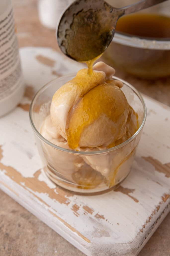 viral olive oil caramel recipe drizzled over ice cream
