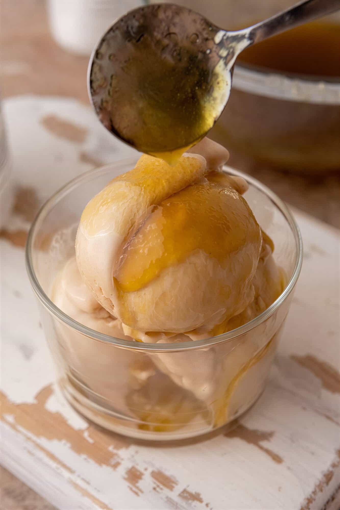 viral olive oil caramel recipe drizzled over ice cream.