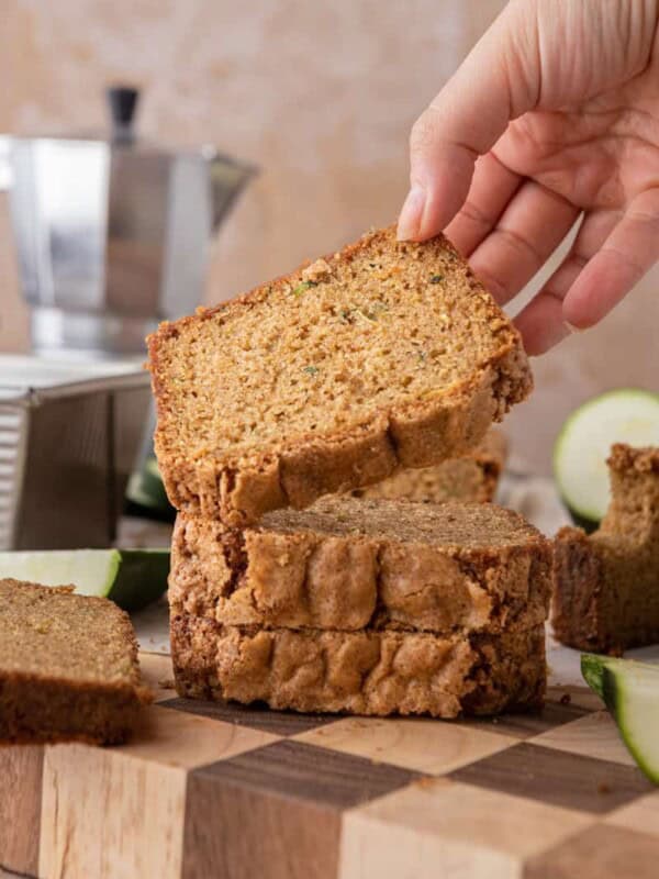 a slice of zucchini bread recipe getting picked up by a hand