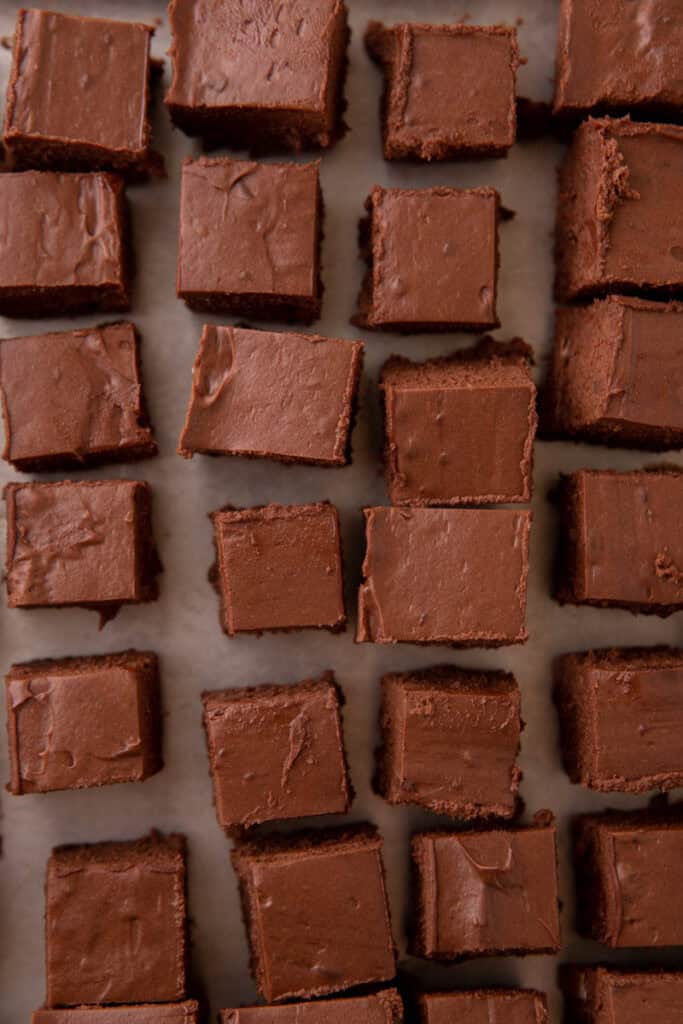 Squares of chilled chocolate filling cut and ready for dipping.
