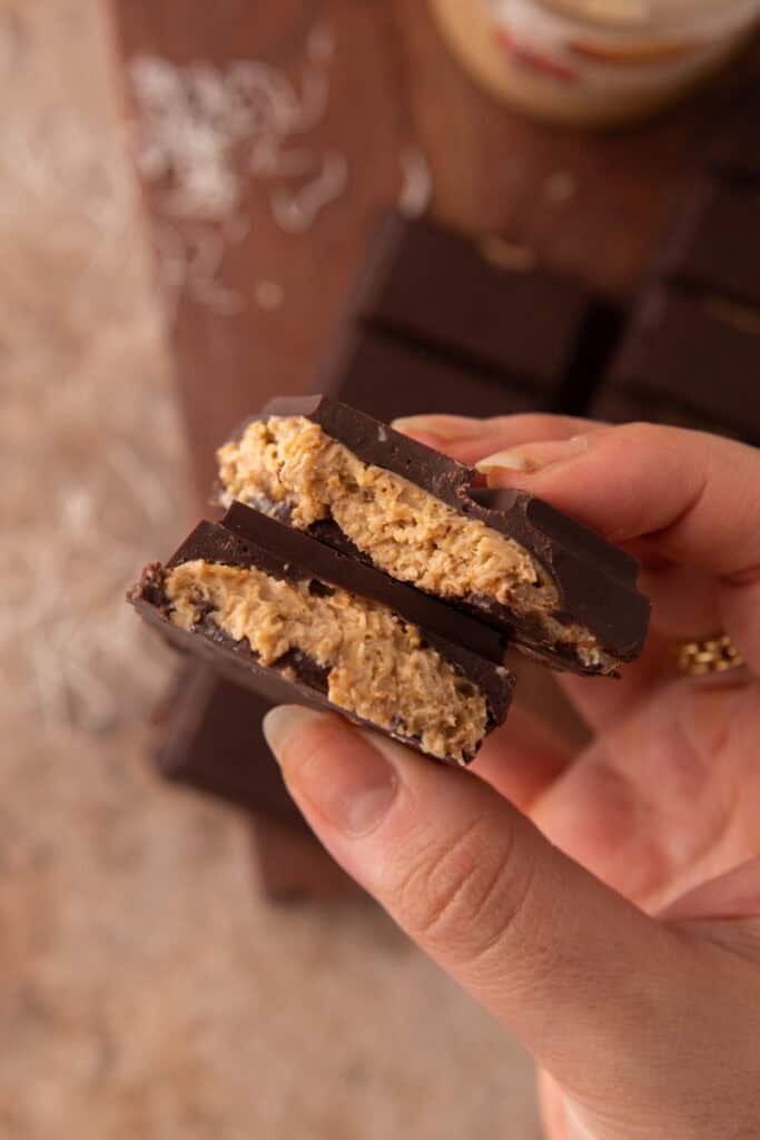 dubai pistachio chocolate bar recipe being held up by a hand