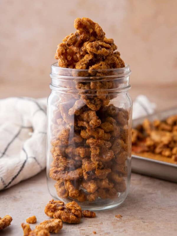 Holiday candied walnuts recipe in a mason jar