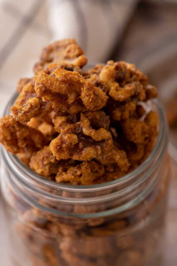 Holiday candied walnuts recipe in a mason jar