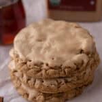 maple glazed oatmeal cookies stacked on top of each other