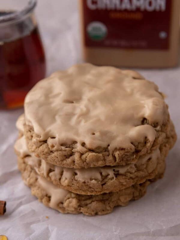maple glazed oatmeal cookies stacked on top of each other