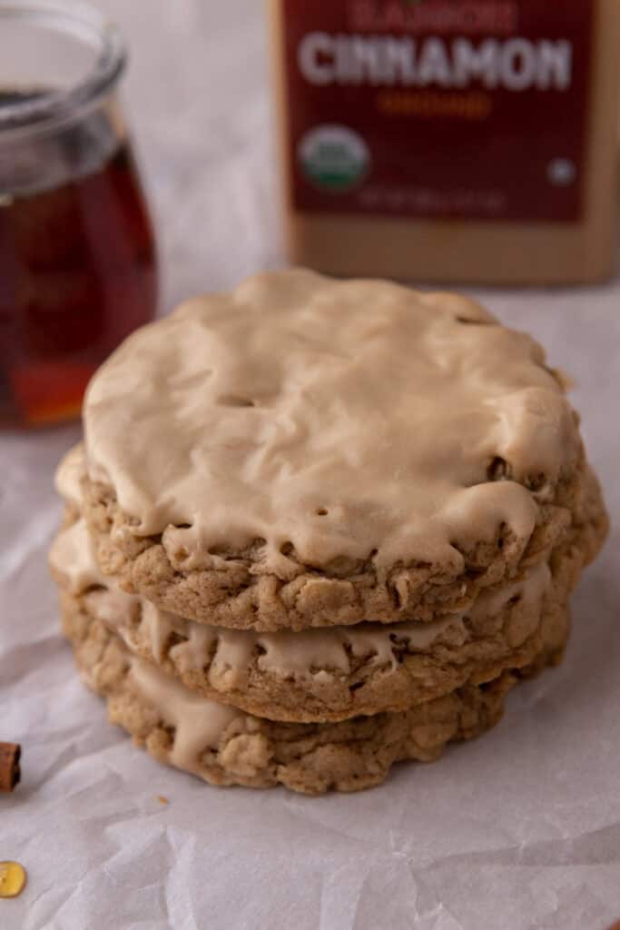 maple glazed oatmeal cookies stacked on top of each other