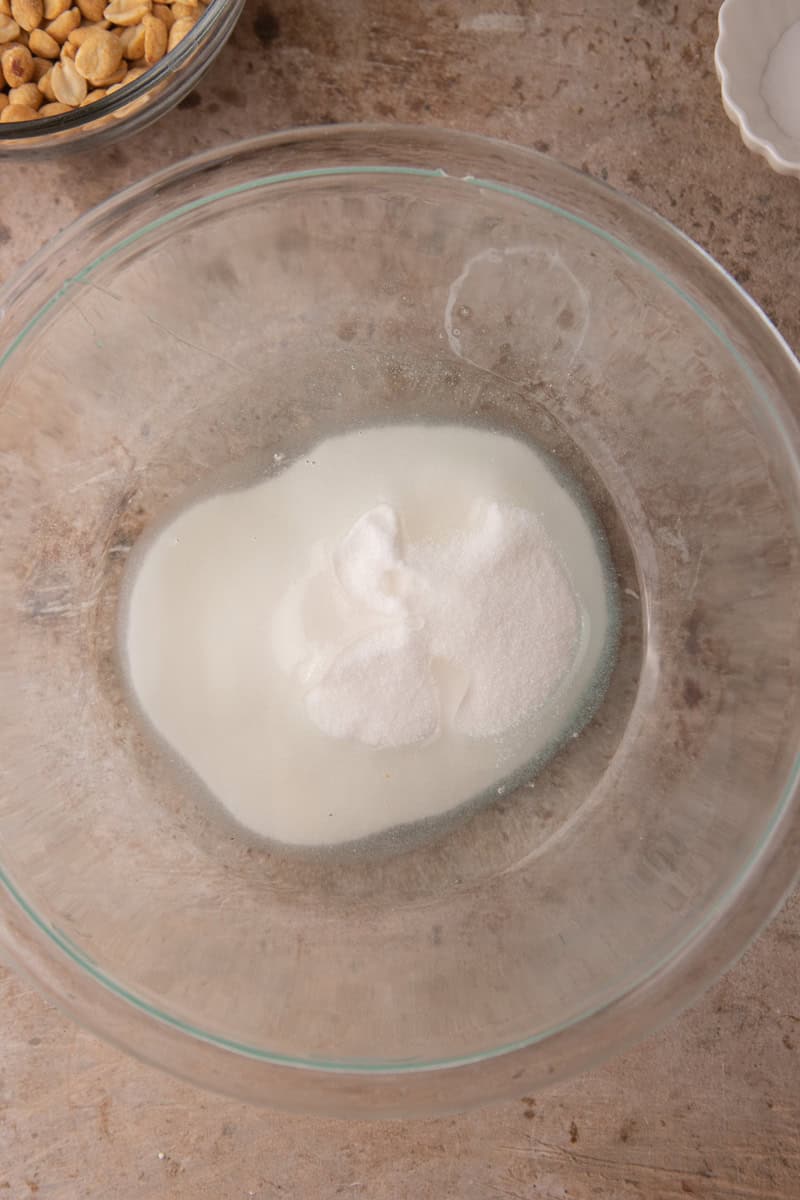 Sugar, light corn syrup, and salt in a glass bowl before microwaving.